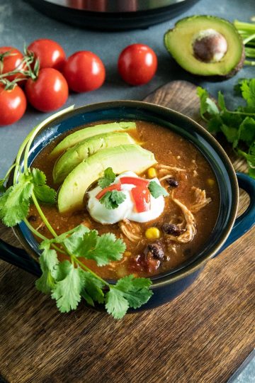 Instant Pot Mexican Chicken Soup with black beans, tomatoes, green chilies and chipotle peppers is a deliciously zesty and comforting meal made quick and easy in your pressure cooker. #mustlovehomecooking