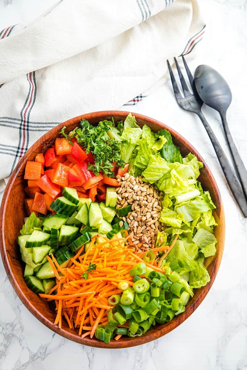 Large wooden bowl with chop salad ingredients