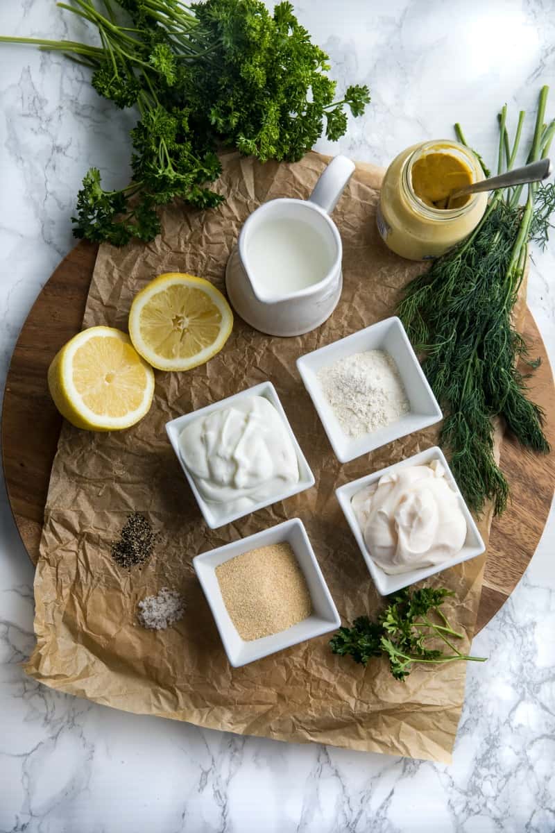 Homemade Buttermilk Herb Dressing with sour cream, mayo, Dijon mustard and lots of fresh herbs is smooth, tangy and full of flavor. This salad dressing is so delicious you'll never settle for bottled again.#mustlovehomecooking