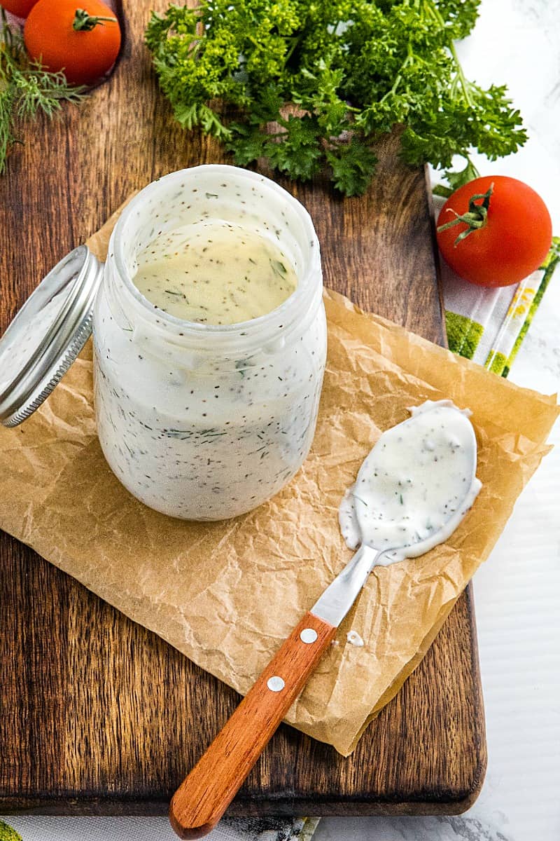 Homemade Buttermilk Herb Dressing with sour cream, mayo, Dijon mustard and lots of fresh herbs is smooth, tangy and full of flavor. This salad dressing is so delicious you'll never settle for bottled again.#mustlovehomecooking