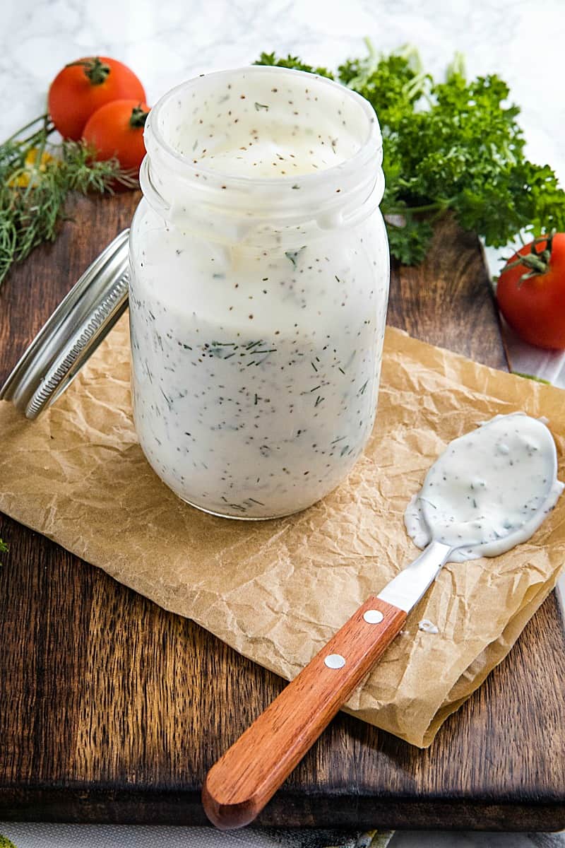 Homemade Buttermilk Herb Dressing with sour cream, mayo, Dijon mustard and lots of fresh herbs is smooth, tangy and full of flavor. This salad dressing is so delicious you'll never settle for bottled again.#mustlovehomecooking