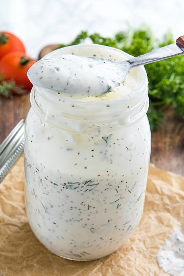 Homemade Buttermilk Herb Dressing with sour cream, mayo, Dijon mustard and lots of fresh herbs is smooth, tangy and full of flavor. This salad dressing is so delicious you'll never settle for bottled again.#mustlovehomecooking