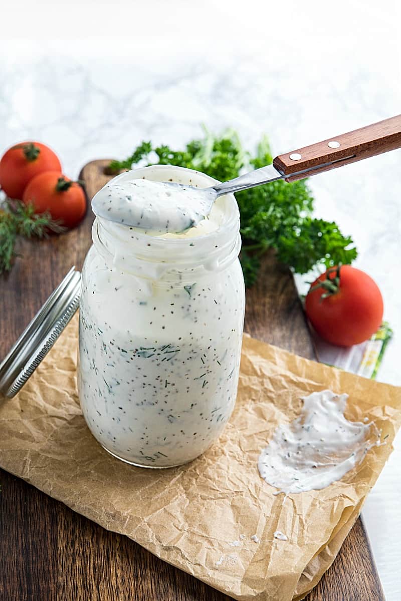 Homemade Buttermilk Herb Dressing with sour cream, mayo, Dijon mustard and lots of fresh herbs is smooth, tangy and full of flavor. This salad dressing is so delicious you'll never settle for bottled again.#mustlovehomecooking