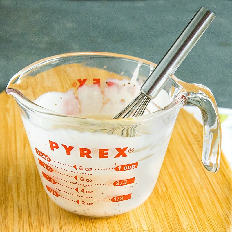 sugar free coleslaw dressing in glass measuring cup