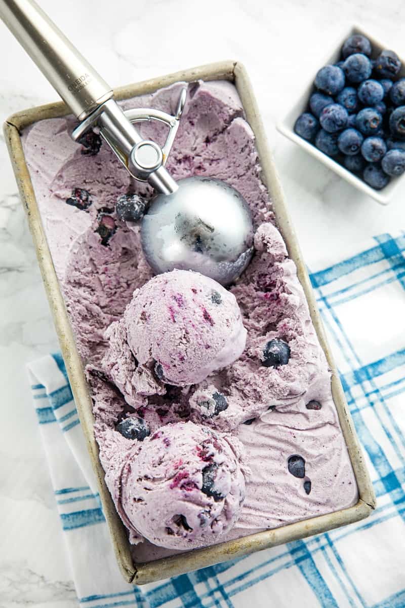 No Churn Cinnamon Blueberry Ice Cream, with fresh blueberries, cinnamon, sweetened condensed milk and cream is a must-have frozen treat that's super easy to make. The smooth flavor will rival any gourmet ice cream.#mustlovehomecooking
