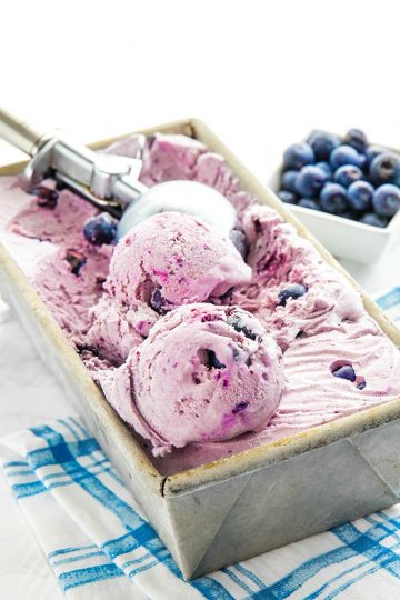 No Churn Cinnamon Blueberry Ice Cream, with fresh blueberries, cinnamon, sweetened condensed milk and cream is a must-have frozen treat that's super easy to make. The smooth flavor will rival any gourmet ice cream. #mustlovehomecooking