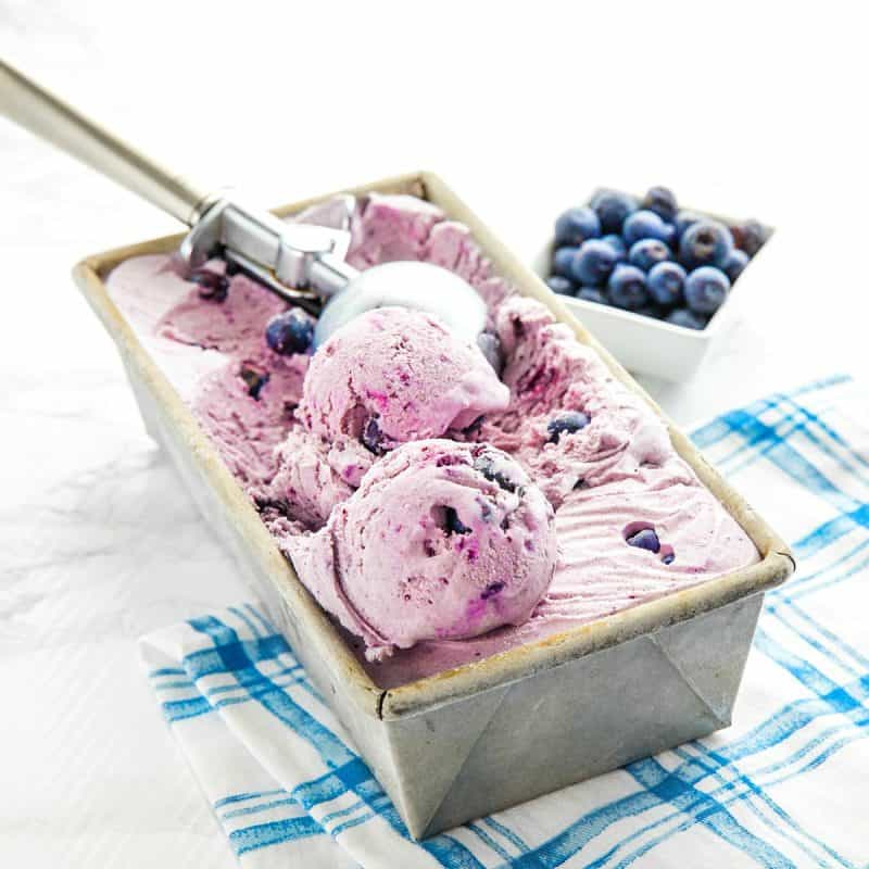 No Churn Cinnamon Blueberry Ice Cream, with fresh blueberries, cinnamon, sweetened condensed milk and cream is a must-have frozen treat that's super easy to make. The smooth flavor will rival any gourmet ice cream. #mustlovehomecooking