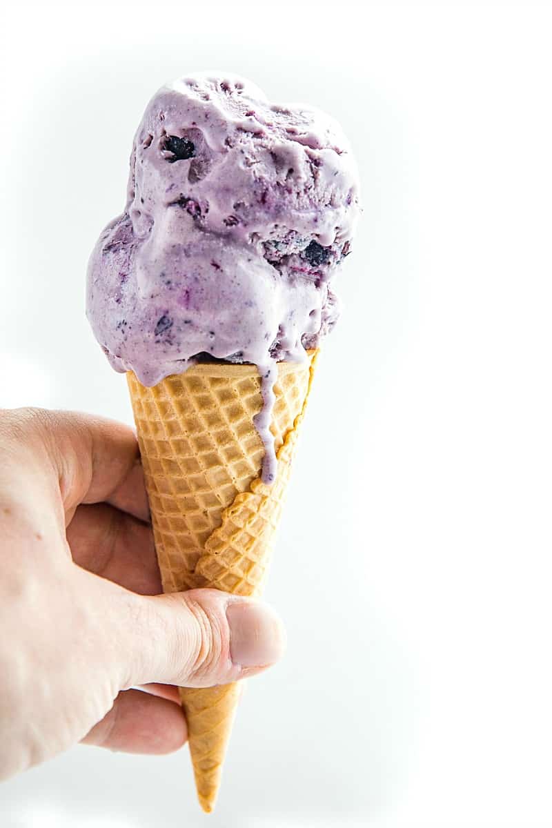 No Churn Cinnamon Blueberry Ice Cream, with fresh blueberries, cinnamon, sweetened condensed milk and cream is a must-have frozen treat that's super easy to make. The smooth flavor will rival any gourmet ice cream. #mustlovehomecooking