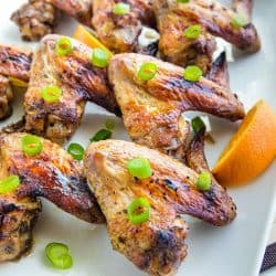 Orange Jerk Chicken Wings are marinated in a zesty homemade blend of orange juice, garlic and spices then baked for a fantastic but oh-so-easy appetizer or meal. #mustlovehomecooking