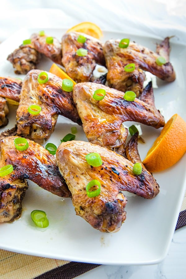 Orange Jerk Chicken Wings are marinated in a zesty homemade blend of orange juice, garlic and spices then baked for a fantastic but oh-so-easy appetizer or meal. #mustlovehomecooking