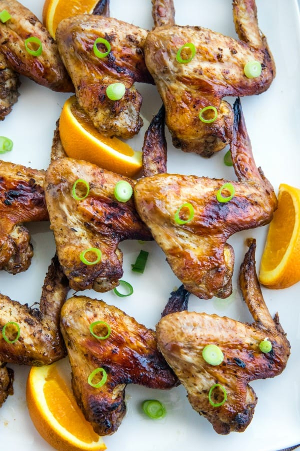 Orange Jerk Chicken Wings are marinated in a zesty homemade blend of orange juice, garlic and spices then baked for a fantastic but oh-so-easy appetizer or meal. #mustlovehomecooking