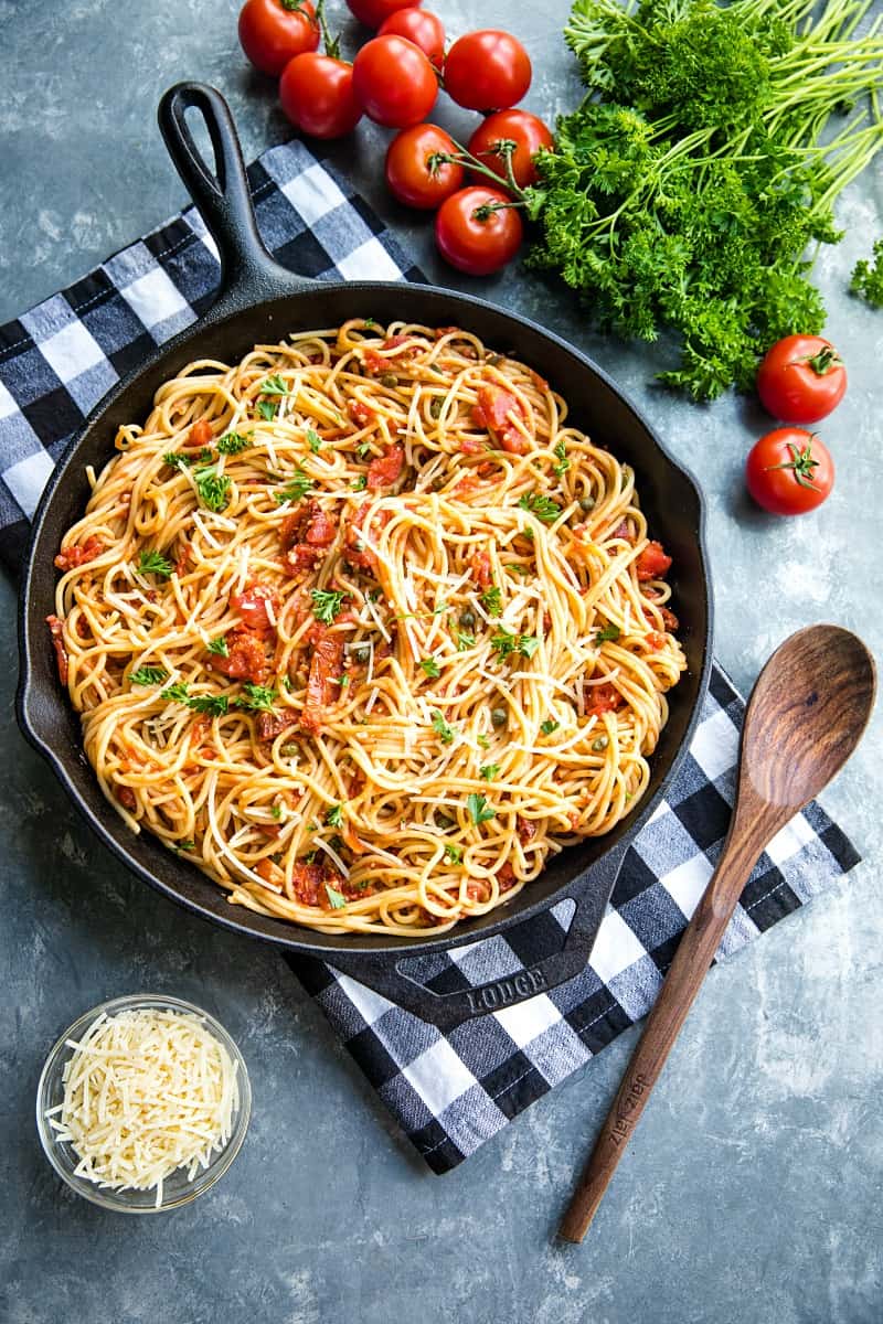 Sun Dried Tomato Puttanesca with tomatoes, anchovies and capers is super fragrant and bursting with flavor...an Italian original made with simple pantry ingredients. #mustlovehomecooking