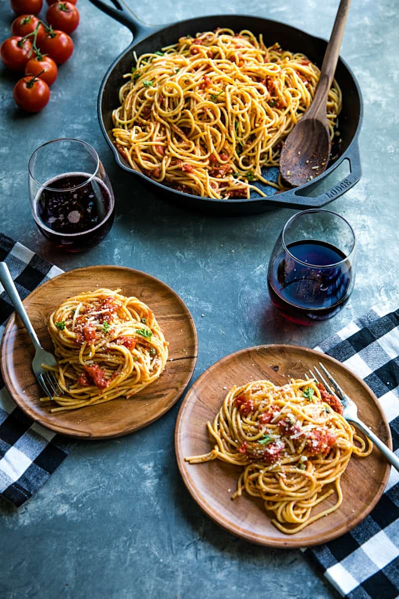 Sun Dried Tomato Puttanesca with tomatoes, anchovies and capers is super fragrant and bursting with flavor...an Italian original made with simple pantry ingredients. #mustlovehomecooking