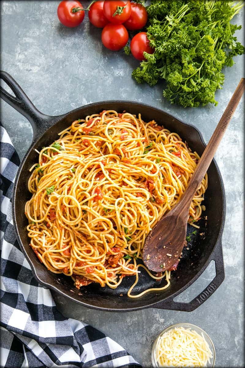 Sun Dried Tomato Puttanesca with tomatoes, anchovies and capers is super fragrant and bursting with flavor...an Italian original made with simple pantry ingredients. #mustlovehomecooking