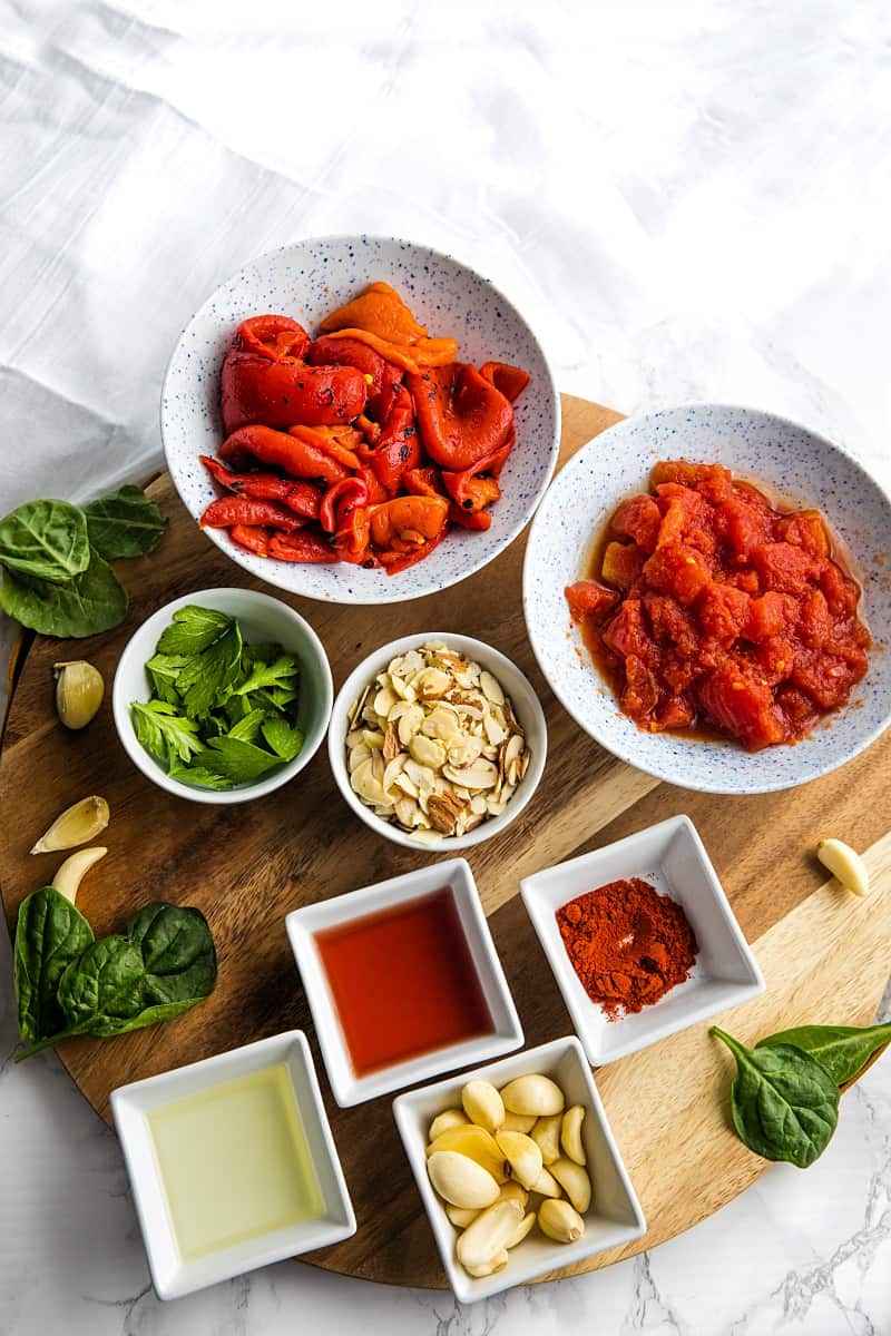 Easy Smooth Romesco Sauce with roasted red peppers. tomato, almonds and garlic. A bold snappy sauce perfect for pasta, chicken, eggs and more.