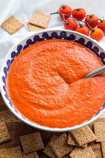 Easy Smooth Romesco Sauce with roasted red peppers. tomato, almonds and garlic. A bold snappy sauce perfect for pasta, chicken, eggs and more. #mustlovehomecooking