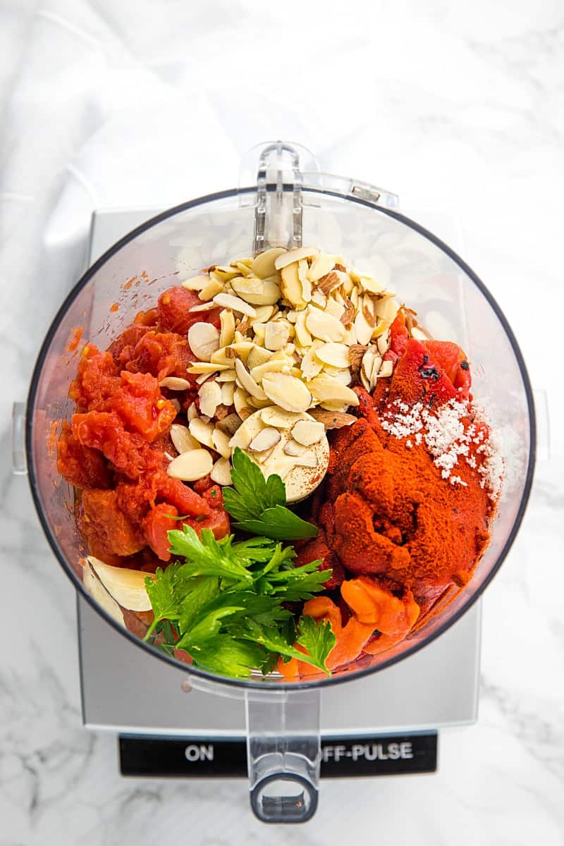 Easy Smooth Romesco Sauce with roasted red peppers. tomato, almonds and garlic. A bold snappy sauce perfect for pasta, chicken, eggs and more.