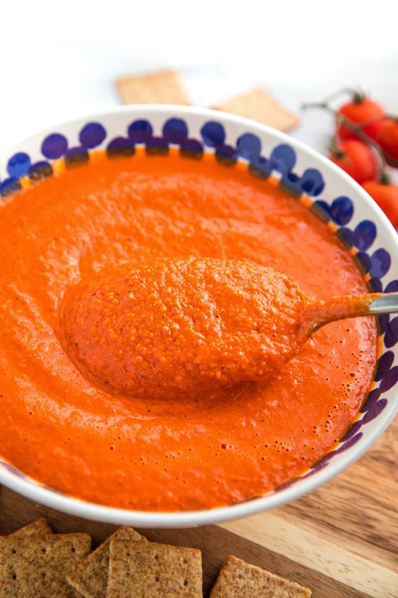 Easy Smooth Romesco Sauce with roasted red peppers. tomato, almonds and garlic. A bold snappy sauce perfect for pasta, chicken, eggs and more.