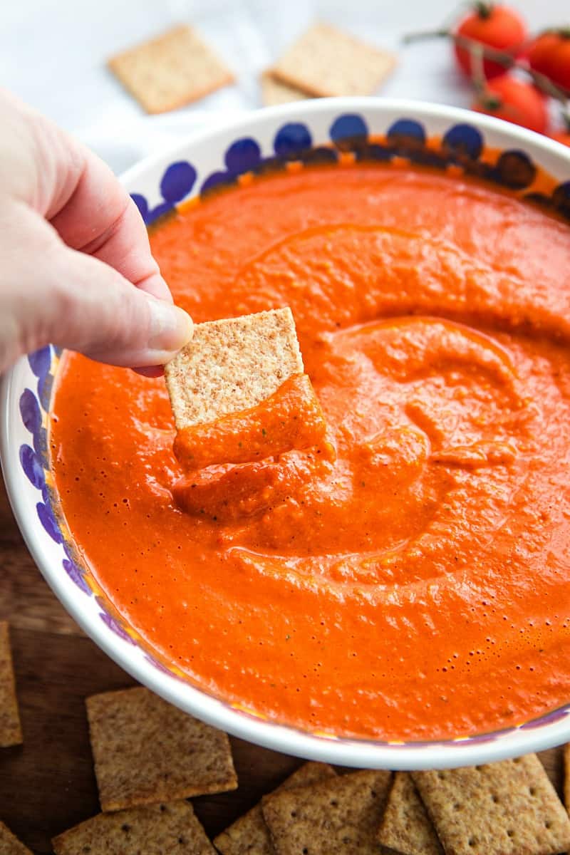 Easy Smooth Romesco Sauce with roasted red peppers. tomato, almonds and garlic. A bold snappy sauce perfect for pasta, chicken, eggs and more.