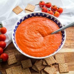 Easy Smooth Romesco Sauce with roasted red peppers. tomato, almonds and garlic. A bold snappy sauce perfect for pasta, chicken, eggs and more.