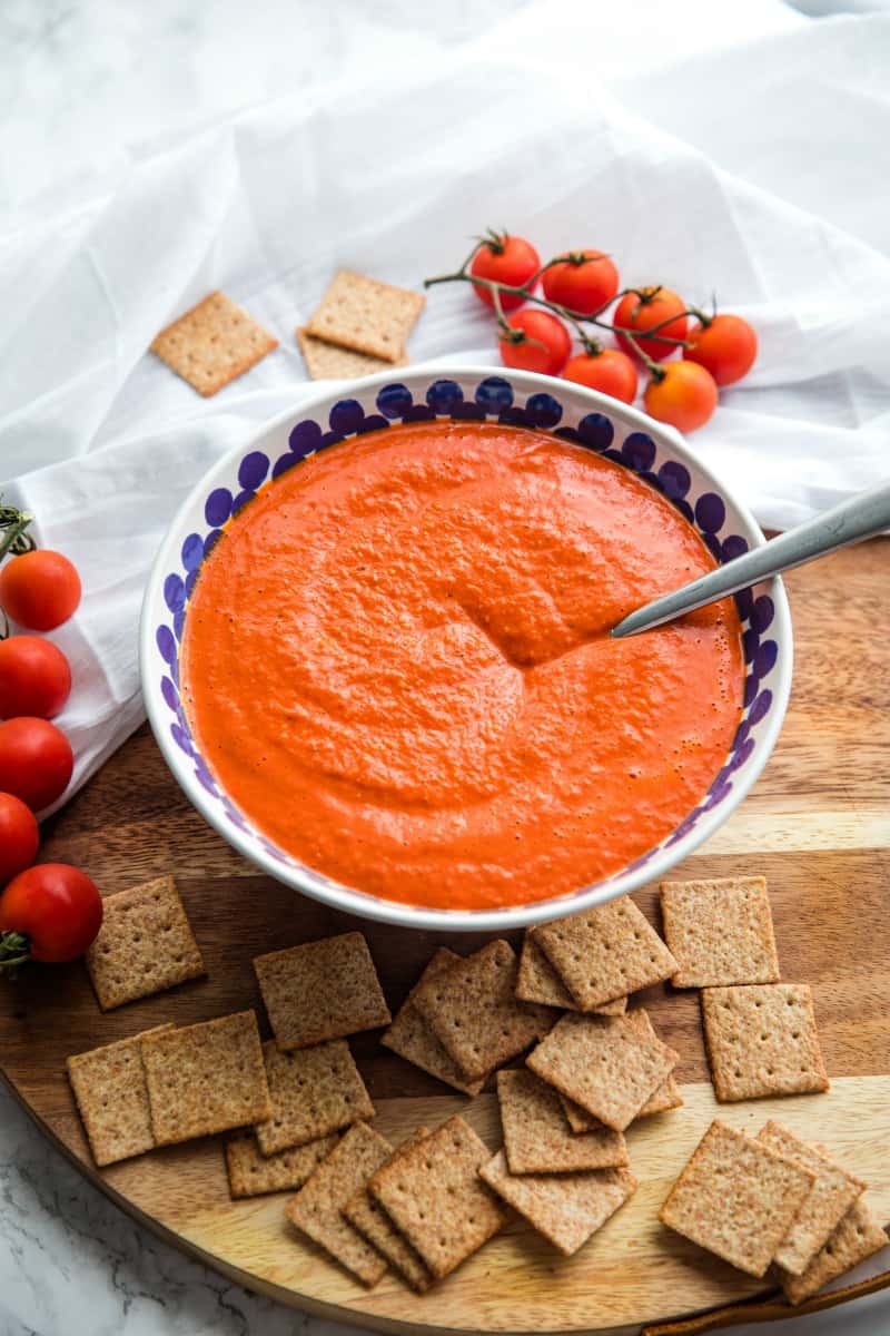 Easy Smooth Romesco Sauce with roasted red peppers. tomato, almonds and garlic. A bold snappy sauce perfect for pasta, chicken, eggs and more.