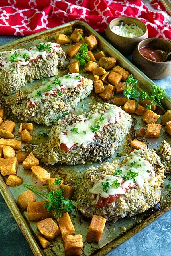 Sheet Pan Pork Chop Parmesan is an easy and complete sheet pan dinner of juicy, bread crumb and parmesan cheese crusted pork chops with sweet potatoes baked right alongside. #mustlovehomecooking