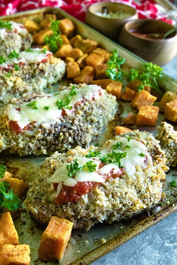 Sheet Pan Pork Chop Parmesan is an easy and complete sheet pan dinner of juicy, bread crumb and parmesan cheese crusted pork chops with sweet potatoes baked right alongside. #mustlovehomecooking