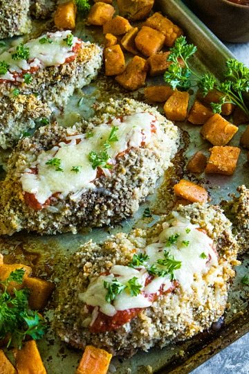 An easy and complete sheet pan dinner of juicy, bread crumb and parmesan cheese crusted pork chops with sweet potatoes baked right alongside. #must5lovehomecooking