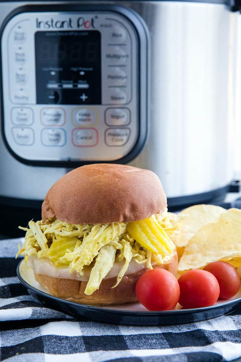 Tangy and flavorful shredded chicken, made with banana peppers and ranch seasoning, ready in minutes from your pressure cooker.#mustlovehomecooking