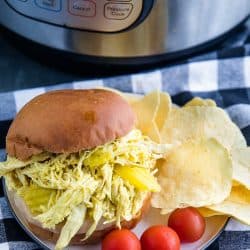 Tangy and flavorful shredded chicken, made with banana peppers and ranch seasoning, ready in minutes from your pressure cooker. #mustlovehomecooking