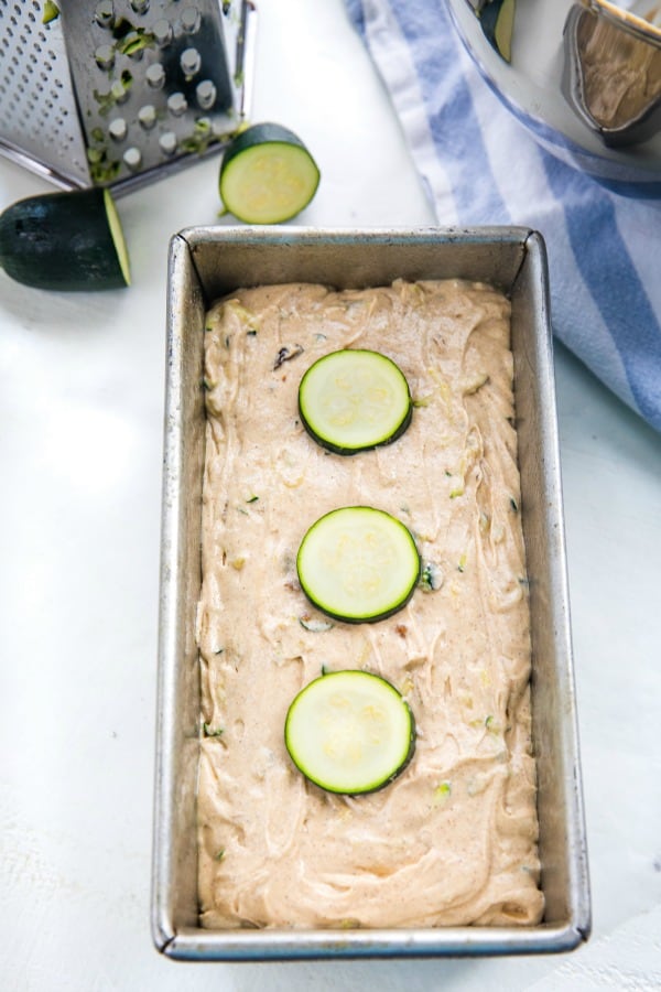 Zucchini batter in a loaf tin, ready for the oven