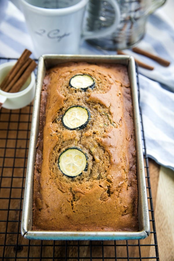 Super moist, buttery quick bread made with tangy sour cream and chock full of raisins, nuts and healthy shredded zucchini.#mustlovehomecooking