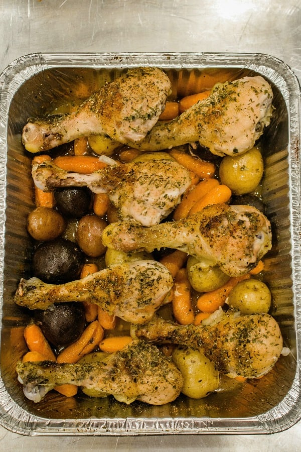 Baked up  juicy and full of garden herb flavor,  this freezer meal with chicken drumsticks, potatoes, carrots and savory sauce is a tasty family favorite.