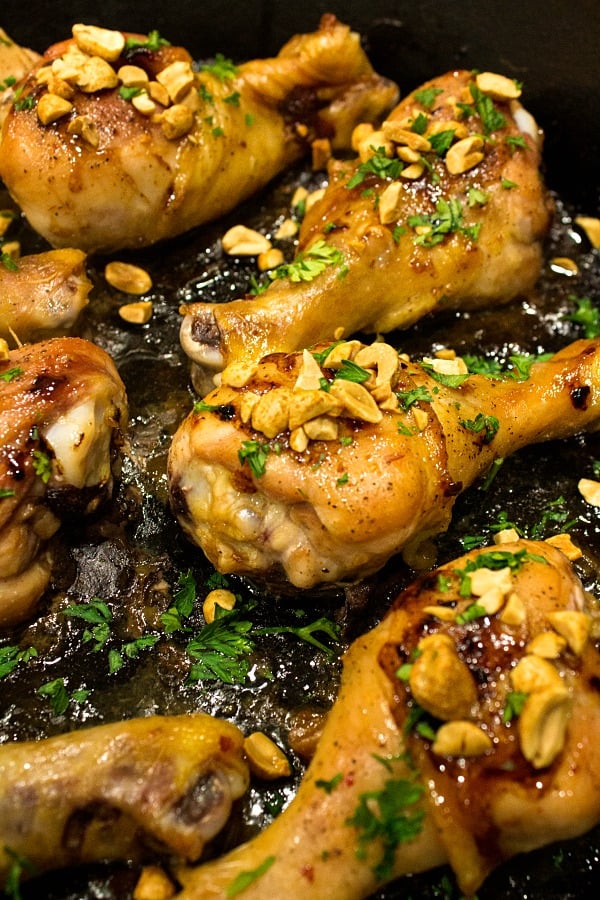 Oven crisp chicken legs and peanuts made into an easy freezer meal with a tasty salty, sweet, and spicy Kung Pao marinade. #mustlovehomecooking