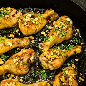 Oven crisp chicken legs and peanuts made into an easy freezer meal with a tasty salty, sweet, and spicy Kung Pao marinade. #mustlovehomecooking