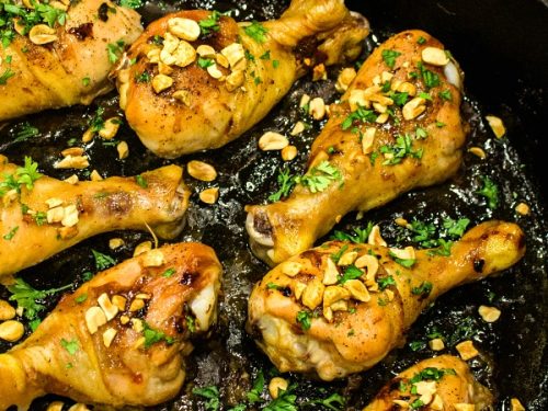 Oven crisp chicken legs and peanuts made into an easy freezer meal with a tasty salty, sweet, and spicy Kung Pao marinade. #mustlovehomecooking