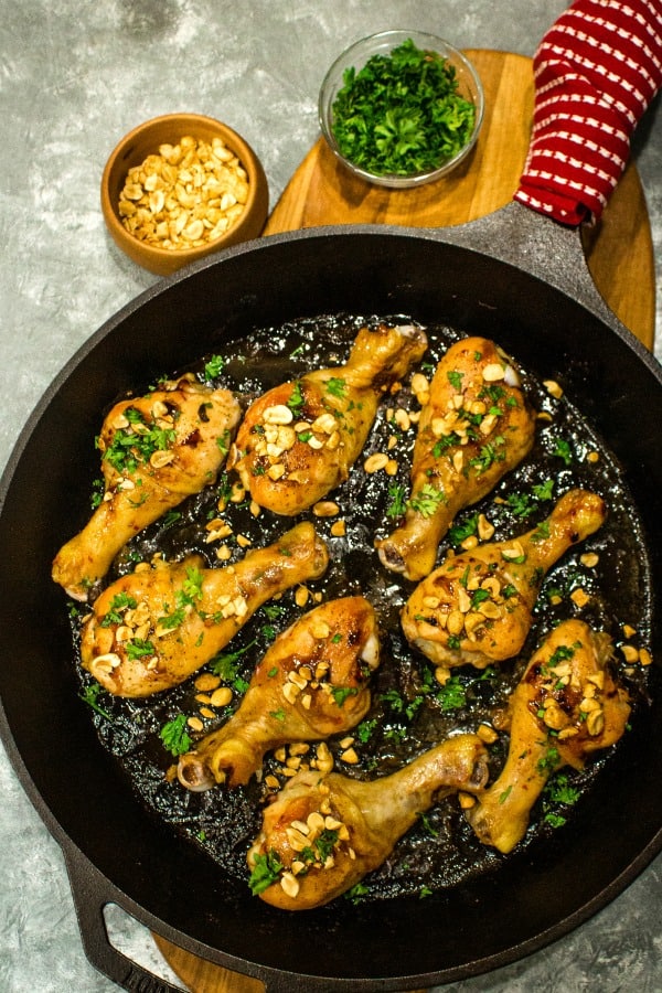 Oven crisp chicken legs and peanuts made into an easy freezer meal with a tasty salty, sweet, and spicy Kung Pao marinade. #mustlovehomecooking