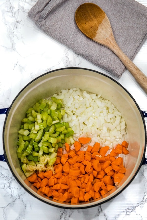 Carrots, celery and onion soup started in cast iron dutch oven