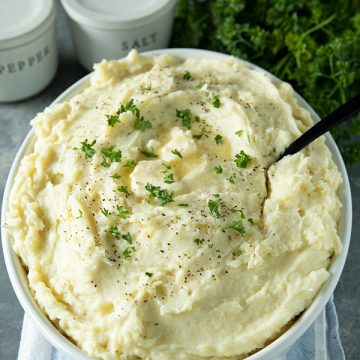 Make Ahead Mashed Potatoes are simple, creamy and so flavorful, made easy with baked potatoes. No peeling or boiling needed. Great for the busy holidays! #mustlovehomecooking