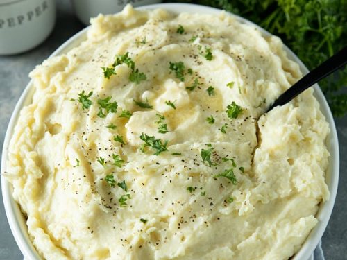 Make Ahead Mashed Potatoes are simple, creamy and so flavorful, made easy with baked potatoes. No peeling or boiling needed. Great for the busy holidays! #mustlovehomecooking