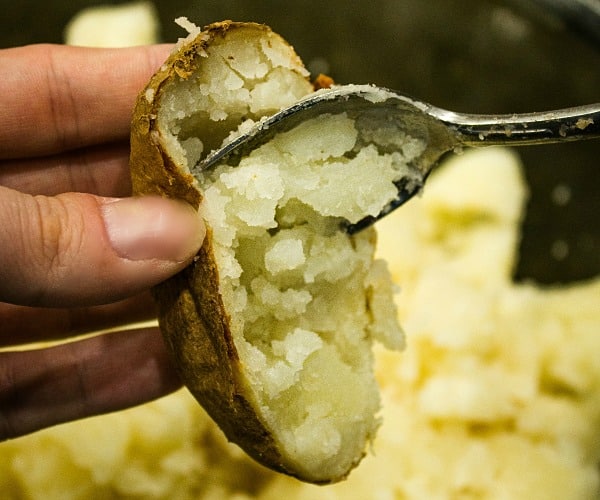 baked potatoes scraped with spoon