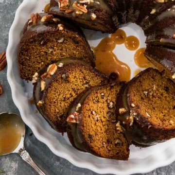 This Pumpkin Bundt Cake is irresistibly spiced, super moist and loaded with toasted pecans. An addictive fall treat you'll crave all year round! #mustlovehomecooking