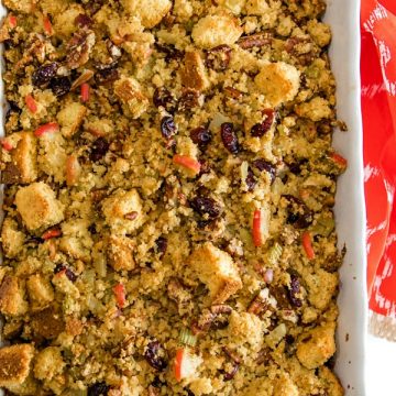 Pecan Apple Cornbread Stuffing made with toasted cornbread , crisp apples, pecans and cranberries, is a delicious sweet and savory dressing that'll be a hit on your holiday table. #mustlovehomecooking
