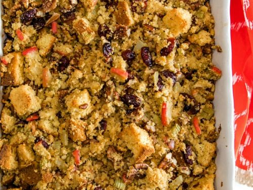 Pecan Apple Cornbread Stuffing made with toasted cornbread , crisp apples, pecans and cranberries, is a delicious sweet and savory dressing that'll be a hit on your holiday table. #mustlovehomecooking