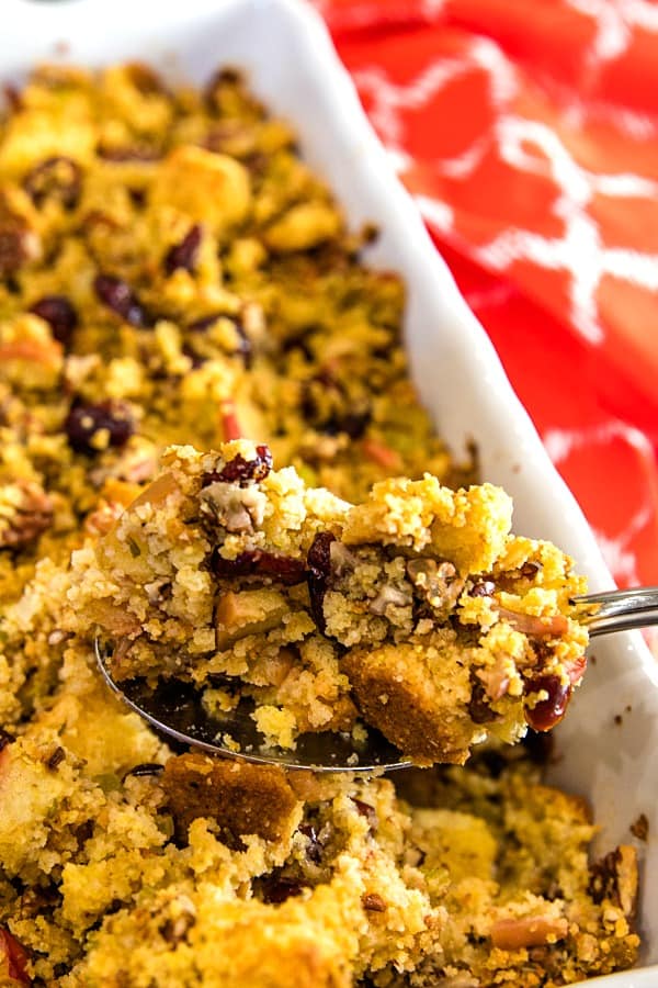 Pecan Apple Cornbread Stuffing made with toasted cornbread , crisp apples, pecans and cranberries, is a delicious sweet and savory dressing that'll be a hit on your holiday table.