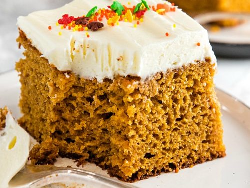 The Best Homemade Pumpkin Cake Ever - baked full of flavor with applesauce and spices then spread with a thick layer of tangy, smooth frosting.