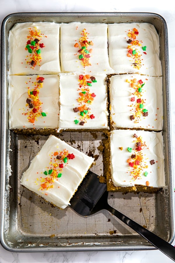 The Best Homemade Pumpkin Cake Ever - baked full of flavor with applesauce and spices then spread with a thick layer of tangy, smooth frosting.