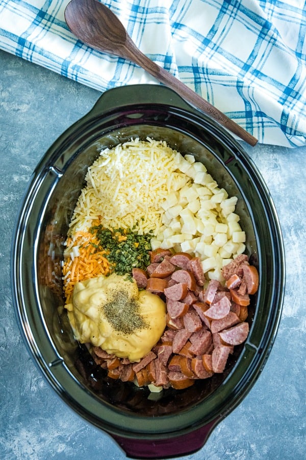 Slow Cooker Smoked Sausage Potatoes is a cozy crockpot meal that's always a dinnertime winner! Easy to make, it's simply comfort food in a bowl.