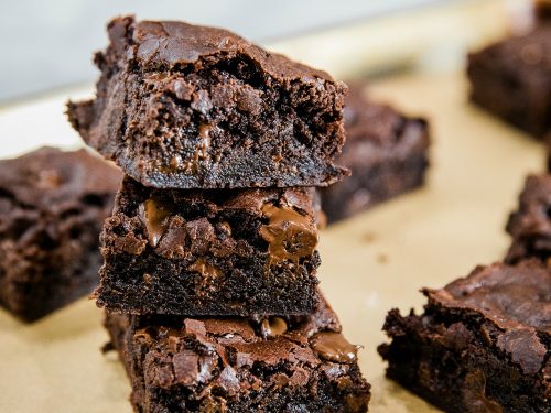 Fudge Brownies from scratch are made with cocoa and semi-sweet chocolate chips for a mouth-watering chewy brownie that will get chocolate lovers' hearts racing.