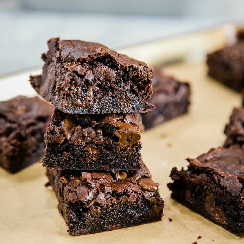 Fudge Brownies from scratch are made with cocoa and semi-sweet chocolate chips for a mouth-watering chewy brownie that will get chocolate lovers' hearts racing.